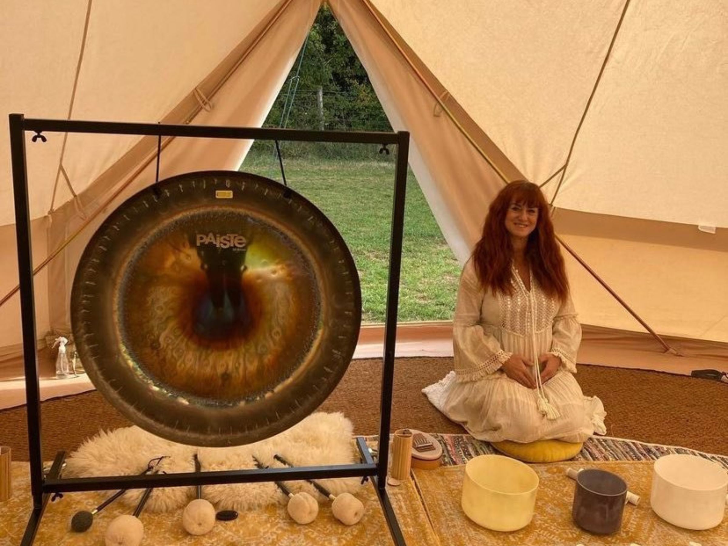 Image of Rachel with gong, bowls and drums ready for a sound healing gong immmersion session