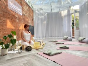 Image of Rachel set up with bowls and mats laid out for an in person alchemy sound healing immersion